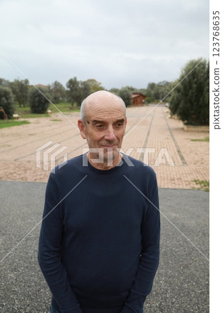 Bald Senior Man Smiles Saying Yes With His Face Outdoors In The Park Bald Senior Man Smiles Saying Yes With His Face Outdoors In The Park 123768635