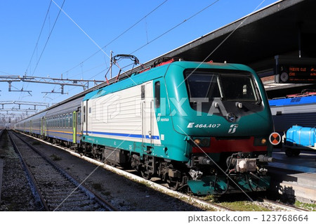 Electric locomotive and passenger car, Santa Lucia Station, Venice, Italy 123768664