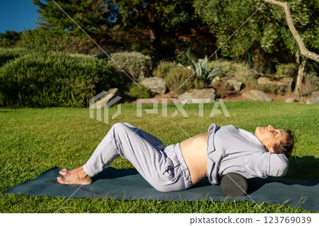 Senior woman releasing back muscles with MFR 123769039
