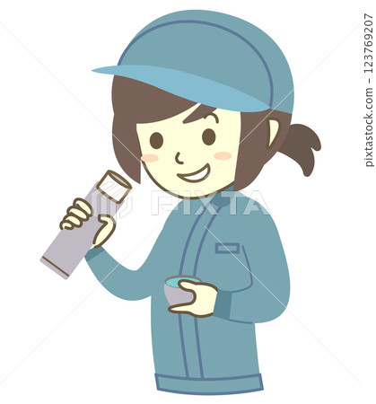 A young female worker hydrates during a break 123769207
