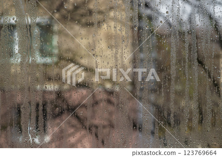 wet glass. a fogged window with water droplets 123769664