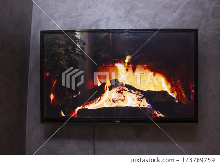 Virtual Fireplace on TV 123769759