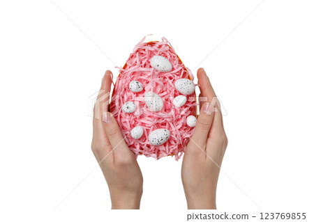 PNG, Easter, egg formed from paper shavings with quail eggs, with hands, isolated on white background 123769855