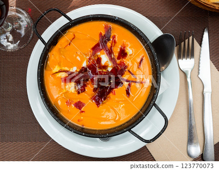 Cordoban salmorejo with ham and egg shavings Cordoban salmorejo with ham and egg shavings 123770073