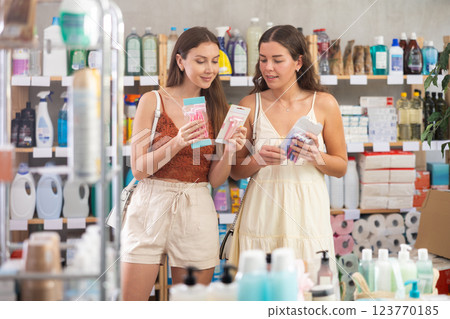 Female customers choosing razors in hygiene and personal care store Female customers choosing razors in hygiene and personal care store 123770185