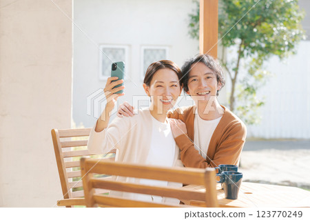 A couple taking photos with a smartphone 123770249