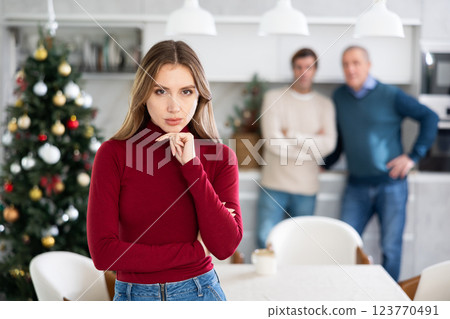 Two men quarreling with young woman 123770491