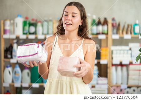 Girl choose woman pads in household shop 123770504