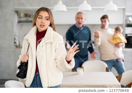 Two men quarreling with young woman 123770648