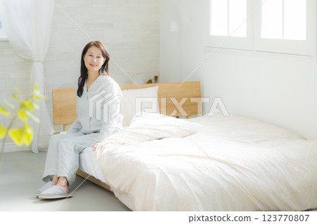 Senior woman stretching in bed 123770807