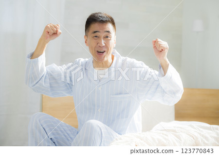 Senior man in bed 123770843