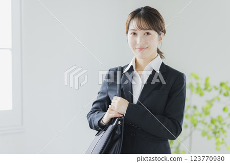 A smiling business woman in a suit 123770980