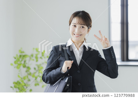 A smiling business woman in a suit 123770988