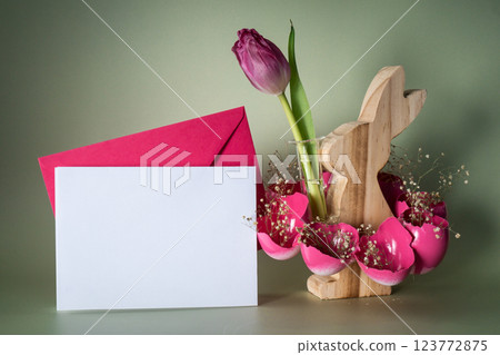 Self made vibrant white envelope sample egg shell with wooden bunny vase handmade decoration for Easter holiday. Copy space greeting card present gift ideas. Tulip flower Creative reuse zero waste 123772875