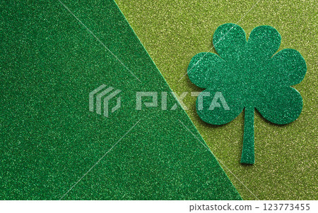 Happy St Patrick's Day decoration concept made from shamrocks ( clover leaf) on green background. 123773455