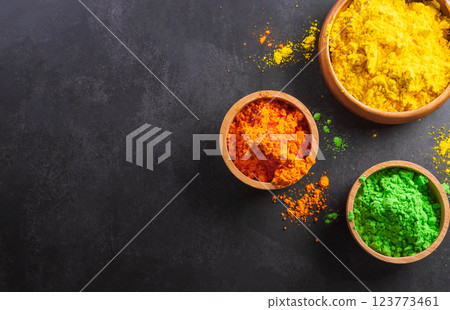 Happy Holi decoration, the indian festival.Top view of colorful holi powder on dark background. 123773461