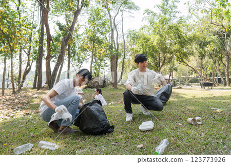 Volunteers engaging in a community cleanup, promoting sustainability and environmental awareness. 123773926