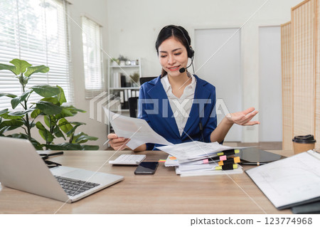 Professional accountant assisting clients with tax filing and financial documents 123774968