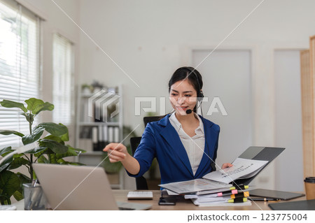 Professional accountant assisting clients via video call, showcasing expertise in finance and tax preparation. Professional accountant assisting clients via video call, showcasing expertise in finance and tax preparation. 123775004