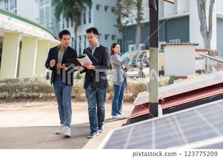 Sustainable business. Professionals walking and discussing solar energy advancement. 123775209