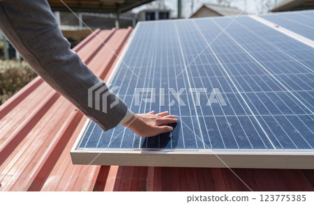 Sustainable innovation. Business professional engaging with solar panel technology. Sustainable innovation. Business professional engaging with solar panel technology. 123775385