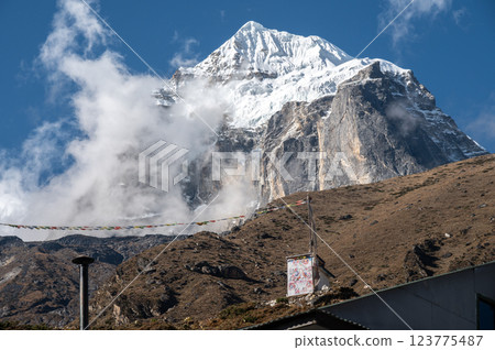 Taboche mountain (6,495 m) a sacred mountains seen from Pangboche village in Sagarmatha national park, Nepal. 123775487