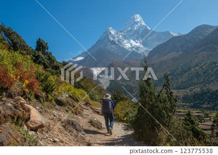Tourist trekking in Nepal with beautiful view of Mt.Ama Dablam (6,812 m). Ama Dablam is one of the most beautiful mountains in the world. Tourist trekking in Nepal with beautiful view of Mt.Ama Dablam (6,812 m). Ama Dablam is one of the most beautiful mountains in the world. 123775538