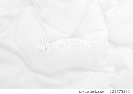 Close up top view of white bedding sheet and wrinkle messy blanket in bedroom after wake up in the morning. Close up top view of white bedding sheet and wrinkle messy blanket in bedroom after wake up in the morning. 123775893