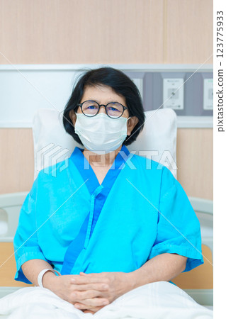 Elderly asian Patient Woman recovery after surgery. Happy Senior illness resting in hospital. Influenza, Fever, treatment, Insurance, Health care and medical, world day of Sick and Health day concept 123775933