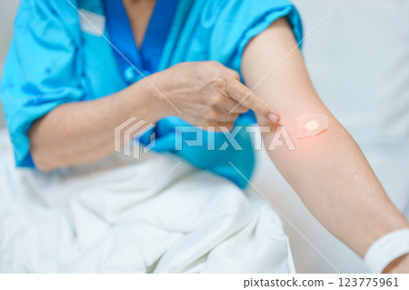 Elderly asian Patient Woman with medical patch plaster after blood test in hospital. Diagnose, illness, treatment, Insurance, Healthcare, medical Examination, Blood donation and World Blood Donor Day Elderly asian Patient Woman with medical patch plaster after blood test in hospital. Diagnose, illness, treatment, Insurance, Healthcare, medical Examination, Blood donation and World Blood Donor Day 123775961