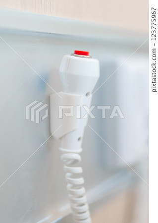 emergency button in hospital room, calling nurse in emergency case. Professional Medical system and Safety Alert 123775967
