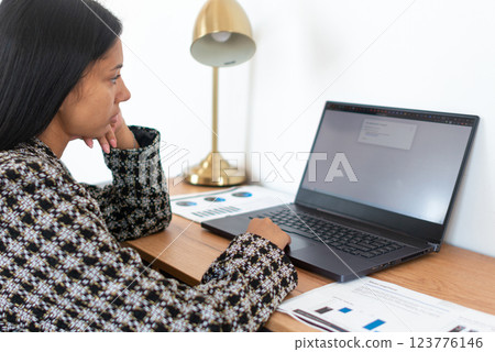 Woman working or studying at home Woman working or studying at home 123776146