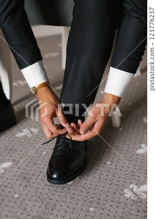 Stylish Groom Preparing For Wedding Day Stylish Groom Preparing For Wedding Day 123776237