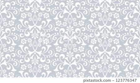Wallpaper in the style of Baroque. White and gray floral ornament. Seamless vector background. Graphic pattern for fabric, wallpaper, packaging. Ornate Damask flower illustration 123776347