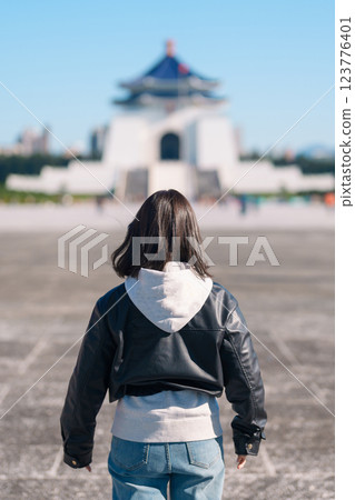 woman traveler visiting in Taiwan, female Tourist sightseeing at National Chiang Kai shek Memorial or Hall Freedom Square, Taipei City. Popular landmark and attractions. Asia Travel concept woman traveler visiting in Taiwan, female Tourist sightseeing at National Chiang Kai shek Memorial or Hall Freedom Square, Taipei City. Popular landmark and attractions. Asia Travel concept 123776401
