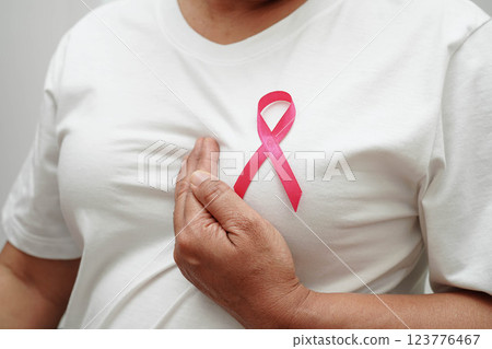 Asian woman with pink ribbon, World Breast Cancer Day at October. Asian woman with pink ribbon, World Breast Cancer Day at October. 123776467