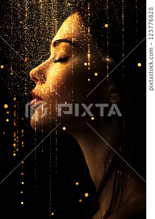 Profile of a woman wrapped in a fantastic golden glow 123776828