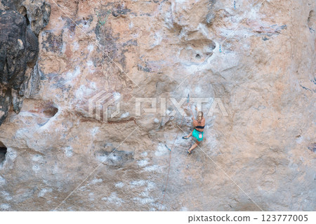 Tourists enjoy and Climbing Mountain at Railay Beach near Phra nang Cave Beach in Krabi, Thailand. Krabi, Thailand, 22  February 2025 123777005