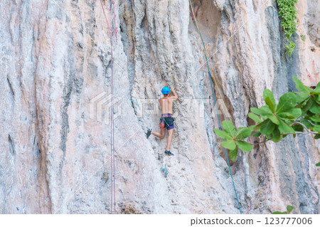 Tourists enjoy and Climbing Mountain at Railay Beach near Phra nang Cave Beach in Krabi, Thailand. Krabi, Thailand, 22  February 2025 123777006