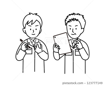 A middle-aged man explaining things on a tablet to a young man in work clothes who is taking notes 123777149