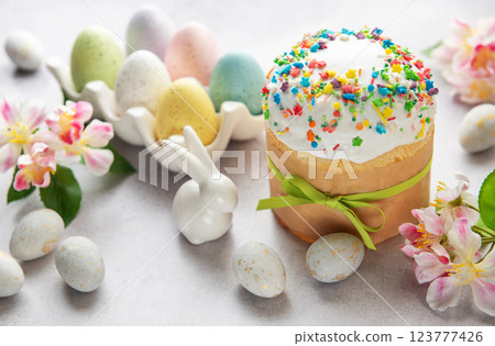 Delicious easter cake with colorful sprinkles, eggs, flowers and bunny  123777426