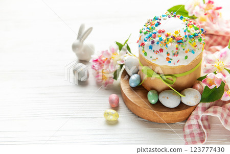 Easter cake with colorful topping, bunny and painted eggs celebrating easter holidays 123777430
