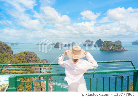 Woman tourist traveling in Krabi, Thailand. happy traveller enjoy and sightseeing view at koh Hong island viewpoint. summer trip, destination, Southeast Asia Travel, vacation and holiday concept 123777965