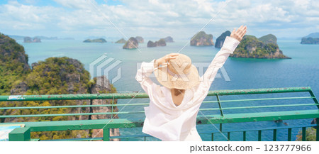 Woman tourist traveling in Krabi, Thailand. happy traveller enjoy and sightseeing view at koh Hong island viewpoint. summer trip, destination, Southeast Asia Travel, vacation and holiday concept 123777966