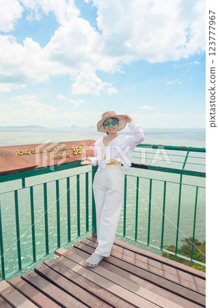 Woman tourist traveling in Krabi, Thailand. happy traveller enjoy and sightseeing view at koh Hong island viewpoint. summer trip, destination, Southeast Asia Travel, vacation and holiday concept Woman tourist traveling in Krabi, Thailand. happy traveller enjoy and sightseeing view at koh Hong island viewpoint. summer trip, destination, Southeast Asia Travel, vacation and holiday concept 123777967
