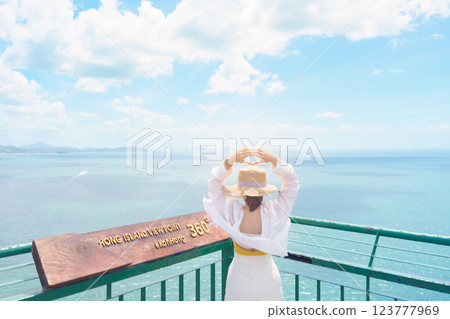 Woman tourist traveling in Krabi, Thailand. happy traveller enjoy and sightseeing view at koh Hong island viewpoint. summer trip, destination, Southeast Asia Travel, vacation and holiday concept 123777969