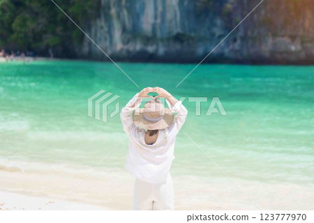 Woman tourist traveling and sightseeing in Krabi, Thailand. happy traveller enjoy on beach at koh Hong island. summer trip, destination, Southeast Asia Travel, vacation and holiday concept 123777970