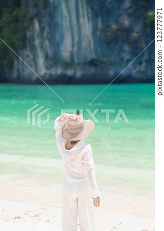 Woman tourist traveling and sightseeing in Krabi, Thailand. happy traveller enjoy on beach at koh Hong island. summer trip, destination, Southeast Asia Travel, vacation and holiday concept 123777971