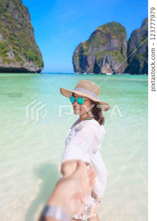 Couple tourist traveling and sightseeing in Krabi, Thailand. happy traveller enjoy at Maya Bay beach on Phi Phi island. Honeymoon trip, destination, Southeast Asia Travel, vacation and holiday concept Couple tourist traveling and sightseeing in Krabi, Thailand. happy traveller enjoy at Maya Bay beach on Phi Phi island. Honeymoon trip, destination, Southeast Asia Travel, vacation and holiday concept 123777979