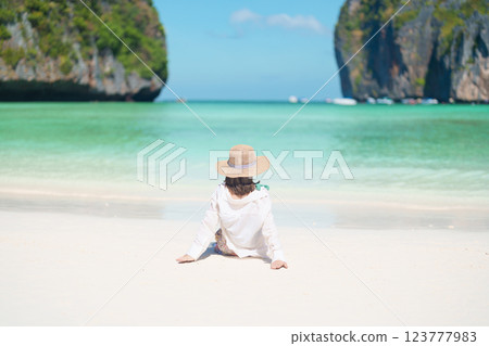 Woman tourist traveling and sightseeing in Krabi, Thailand, happy traveller enjoy at Maya Bay beach on Phi Phi island, Popular paradise island, destination, Southeast Asia Travel, vacation and holiday Woman tourist traveling and sightseeing in Krabi, Thailand, happy traveller enjoy at Maya Bay beach on Phi Phi island, Popular paradise island, destination, Southeast Asia Travel, vacation and holiday 123777983